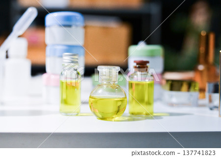 Woman making organic cosmetics with aloe in laboratory Woman making organic cosmetics with aloe in laboratory 137741823