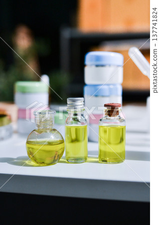 Woman making organic cosmetics with aloe in laboratory Woman making organic cosmetics with aloe in laboratory 137741824