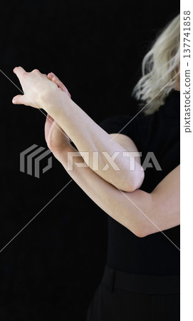 Elegant Female Hands in Graceful Gesture on Black Background Elegant Female Hands in Graceful Gesture on Black Background 137741858