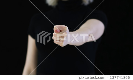 A graceful female hands showing a fig 137741866