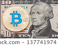 Golden cryptocurrency blue bitcoin on ten dollar banknote backgr 137741974