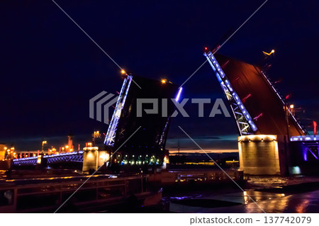 Opening of Palace drawbridge. Night view of Palace bridge from the Neva river in Saint Petersburg, Russia Opening of Palace drawbridge. Night view of Palace bridge from the Neva river in Saint Petersburg, Russia 137742079