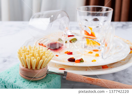 wooden round brush with bristles, for washing dishes, close-up, dirty dishes in the background, cleaning, concept, wooden round brush with bristles, for washing dishes, close-up, dirty dishes in the background, cleaning, concept, 137742220