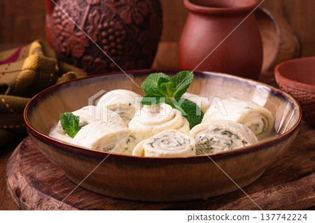 Gebjalia, a traditional Georgian dish, cold appetizer of cheese with mint, Megrelian cuisine, Gebjalia, a traditional Georgian dish, cold appetizer of cheese with mint, Megrelian cuisine, 137742224