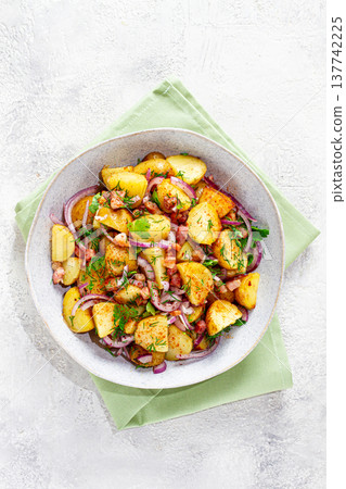 German potato salad, with bacon, onion and herbs, served in a bowl, homemade, no people, German potato salad, with bacon, onion and herbs, served in a bowl, homemade, no people, 137742225