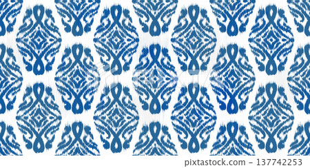 Ikat seamless blue floral pattern with geometric abstract ornament. Traditional decorative woven illustration. Vector grunge textured oriental rug motif background. Ikat seamless blue floral pattern with geometric abstract ornament. Traditional decorative woven illustration. Vector grunge textured oriental rug motif background. 137742253