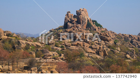Mountain peak and granite boulder, Hampi Hippie Island, Karnataka, India. Mountain peak and granite boulder, Hampi Hippie Island, Karnataka, India. 137742940