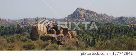 Granite boulder and peak in Hampi, India. Granite boulder and peak in Hampi, India. 137742941
