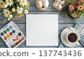 A blank white canvas on a rustic wooden table, with watercolors, flowers, and Easter decor. Concept art, education, DIY creativity, Easter decor. 137743436