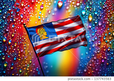 Vibrant flag waving against a rainbow raindrop background. A flag with red and white stripes and a blue square featuring a yellow helmeted figure is set against a vibrant, colorful background. 137743563