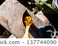Hiker s freeze-dried meal on a plastic spoon over a food pouch. 137744090