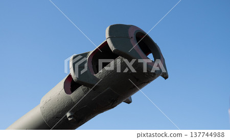 Outdoor Museum Display Decommissioned Gun Against Bright Sky, Weathered Paint And Rusted Surfaces Convey Age And History, Interpretive Context Suitable For Heritage, Education, Or Memorial 137744988
