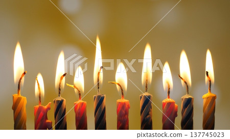 Colorful Candles Ignite Joyful Celebration. Festive Scene With Luminous Birthday Candles And Cheerful Mood. Vibrant Striped Candles Flicker To Create Lively Birthday Atmosphere Colorful Candles Ignite Joyful Celebration. Festive Scene With Luminous Birthday Candles And Cheerful Mood. Vibrant Striped Candles Flicker To Create Lively Birthday Atmosphere 137745023