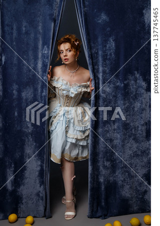 Vintage Woman Peering. Woman Peeks From Backstage Area. Curious Woman Steps Into Faint Illumination 137745465