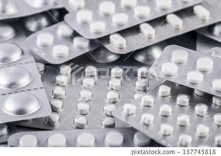 Big heap of many various pills and tablets packs and blisters 137745818
