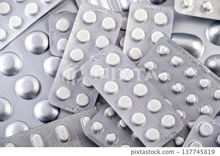 Big heap of many various pills and tablets packs and blisters 137745819