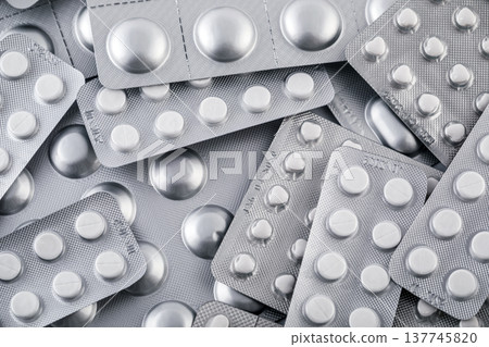 Big heap of many various pills and tablets packs and blisters 137745820