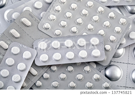 Big heap of many various pills and tablets packs and blisters 137745821