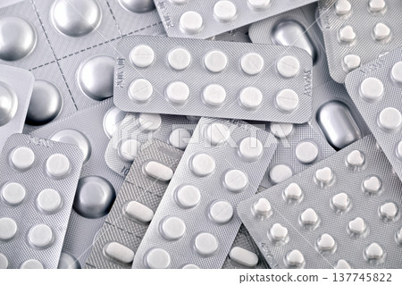 Big heap of many various pills and tablets packs and blisters 137745822