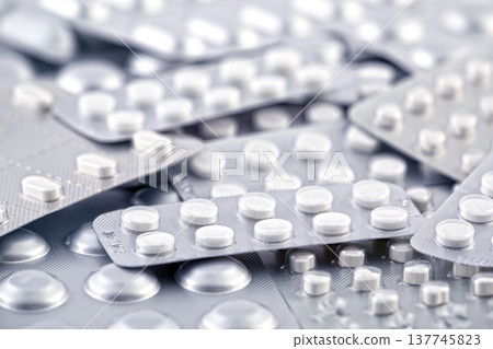Big heap of many various pills and tablets packs and blisters 137745823