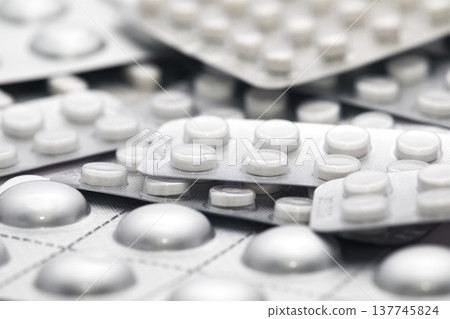 Big heap of many various pills and tablets packs and blisters 137745824