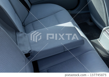 Soft gray fabric covers the back seat, offering a comfortable space for travelers. The detailed stitching adds an elegant touch Soft gray fabric covers the back seat, offering a comfortable space for travelers. The detailed stitching adds an elegant touch 137745873