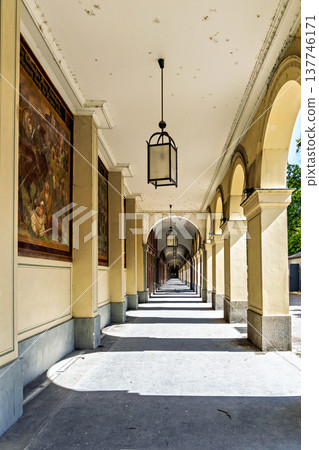 Promenade with long arcade columns surrounding Hofgarten Park in Munich, Germany 137746171