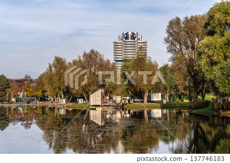 Golden autumn view in the Olympiapark in Munich, Germany, an Olympic Park for the 1972 Summer Olympics Golden autumn view in the Olympiapark in Munich, Germany, an Olympic Park for the 1972 Summer Olympics 137746183