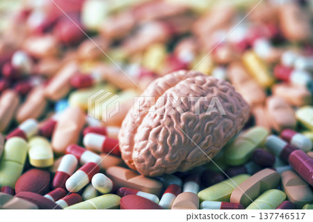 Human brain on heap of medicine pills or dietary supplements Human brain on heap of medicine pills or dietary supplements 137746517