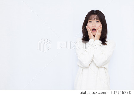 Surprised and amazed woman 137746758