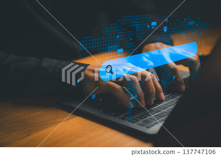 Online search technology concept with hand typing on laptop and digital search bar over world map interface. Global data access, internet research, information discovery and digital business strategy. Online search technology concept with hand typing on laptop and digital search bar over world map interface. Global data access, internet research, information discovery and digital business strategy. 137747106