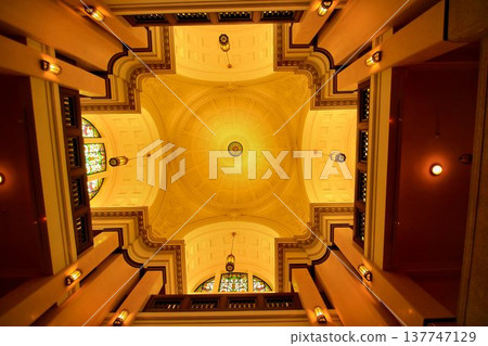 A beautiful Neo-Renaissance style white dome ceiling with stained glass. A beautiful Neo-Renaissance style white dome ceiling with stained glass. 137747129