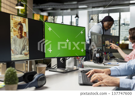 Chroma key screen, PC reels on software, in modern office, startup employee developing marketing strategy used in targeting viral trends and boosting online followers and exposure. 137747600