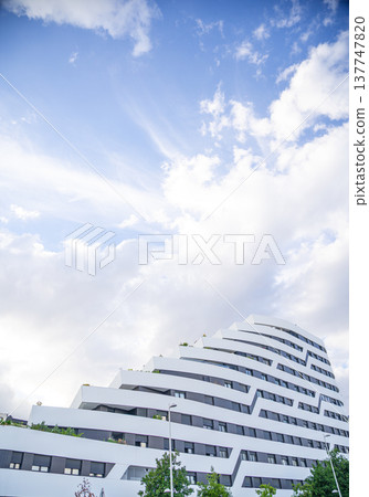 Modern Residential Buildings with a beautiful blue sky background Modern Residential Buildings with a beautiful blue sky background 137747820