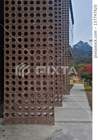 It is a building with a hole in the wall.	 137747920