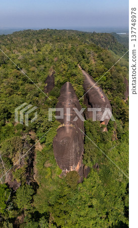High angle view of an iconic Three Whales Rock in Thai called Hin Sam Wan a 75-million-year-old rock formation protruding out of a mountain in Phou Sing, Bueng Kan Province, Thailand. 137748978
