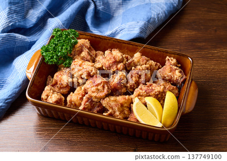 Deep fried chicken served on a large plate 137749100