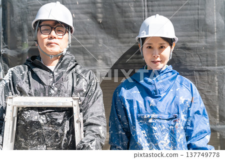 Trusted skills. Experienced and young male and female craftsmen working together on exterior painting sites. Trusted skills. Experienced and young male and female craftsmen working together on exterior painting sites. 137749778
