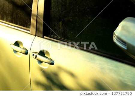 The car body bathed in the setting sun The car body bathed in the setting sun 137751790