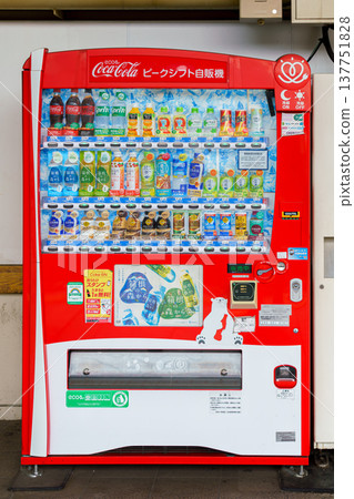 Tokyo, Japan - Sep 30 2024, Vertical close-up view of red vending machine with soft drinks at Tokyo Subway station, without people, at daytime, Tokyo, Japan Tokyo, Japan - Sep 30 2024, Vertical close-up view of red vending machine with soft drinks at Tokyo Subway station, without people, at daytime, Tokyo, Japan 137751828