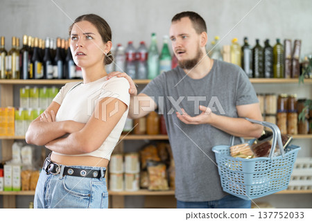 Angry girl turned away from husband during quarrel, he want to make peace after quarrel, calm wife Angry girl turned away from husband during quarrel, he want to make peace after quarrel, calm wife 137752033