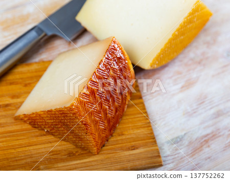 Sliced spanish semi hard cheese from cow milk Sliced spanish semi hard cheese from cow milk 137752262