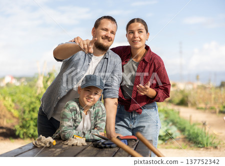 Family of farmers at the table Family of farmers at the table 137752342