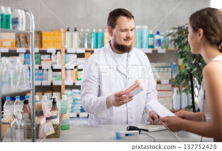 Male pharmacist offers to buy pills for woman at pharmacy Male pharmacist offers to buy pills for woman at pharmacy 137752428
