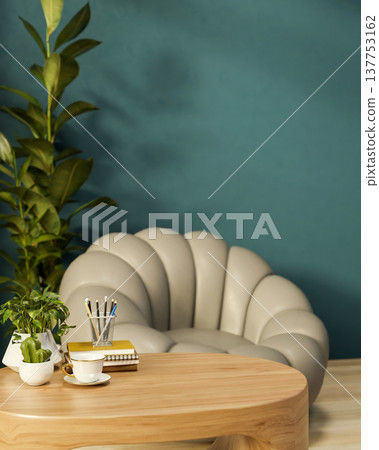 Books and coffee on wooden table with pumpkin sofa chair on wooden parquet floor in green wall room. 137753162
