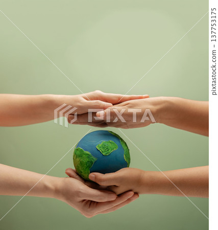 Two people protecting Globe. Safeguarding planet, environmental awareness, sustainability, nature protection Two people protecting Globe. Safeguarding planet, environmental awareness, sustainability, nature protection 137753175
