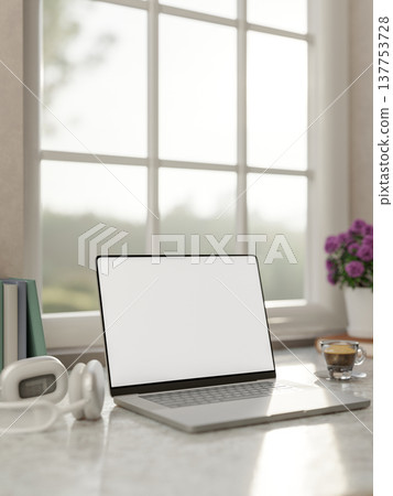 White screen laptop with headphones and coffee aside flower on marble table and sunlight from window White screen laptop with headphones and coffee aside flower on marble table and sunlight from window 137753728