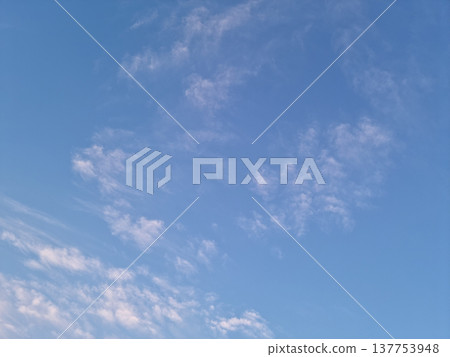 It's a vanilla sky with feathery clouds. It's a vanilla sky with feathery clouds. 137753948