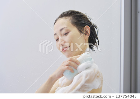 Woman washing body in the bathroom Woman washing body in the bathroom 137754043