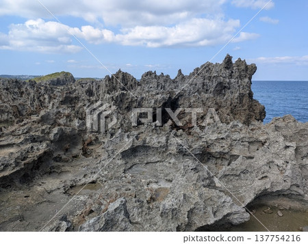 Rocky cliffs and rock faces in Okinawa on a sunny day Rocky cliffs and rock faces in Okinawa on a sunny day 137754216
